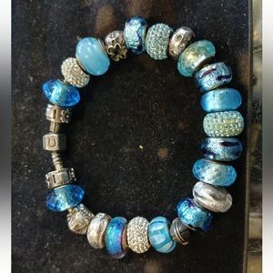 The Chamilia Sterling Silver Bangle Bracelet with 13 Marked 925 Mixed Charms